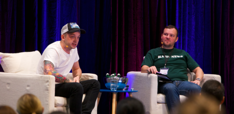 Rob Cooper speaking onstage at CommsCon