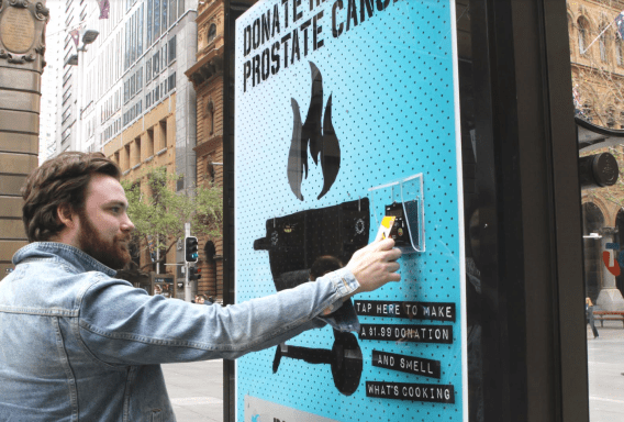 Cancer charity uses scent and sound of sizzling snags in out of home campaign with JCDecaux