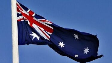 ‘We disappointed many of you’: Woolworths to put flags back on the shelves after Australia Day disaster