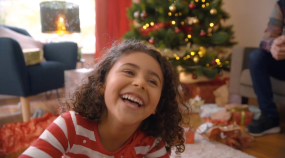 Australia Post uses family footage of Christmas Day and staff opera singing to promote delivery services